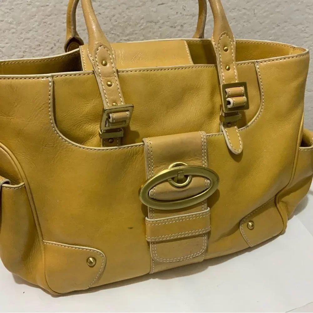 MAXX New York yellow leather shoulder bag.